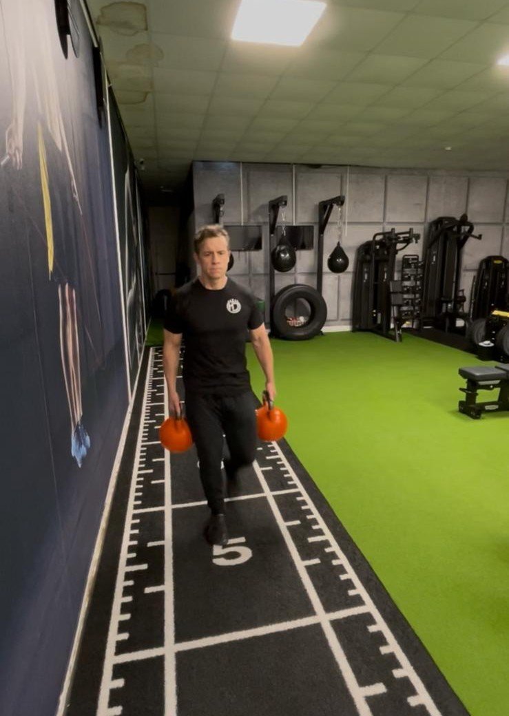 Loaded carry demonstrating the gait and carry movement pattern