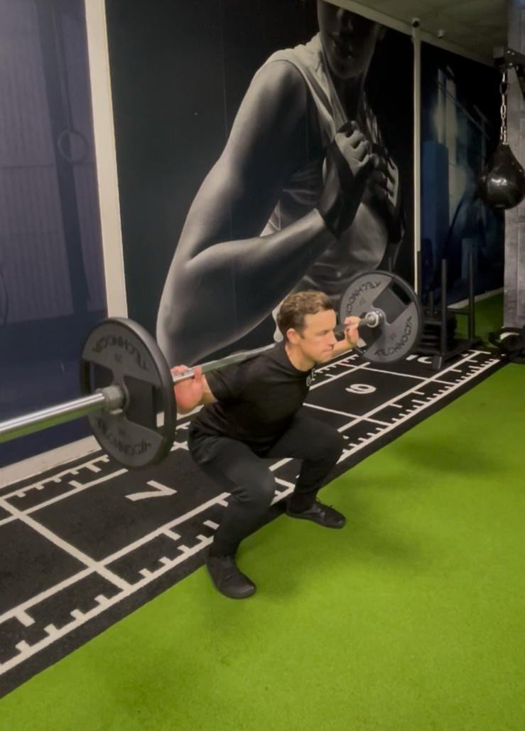 Barbell squat demonstrating the squat movement pattern