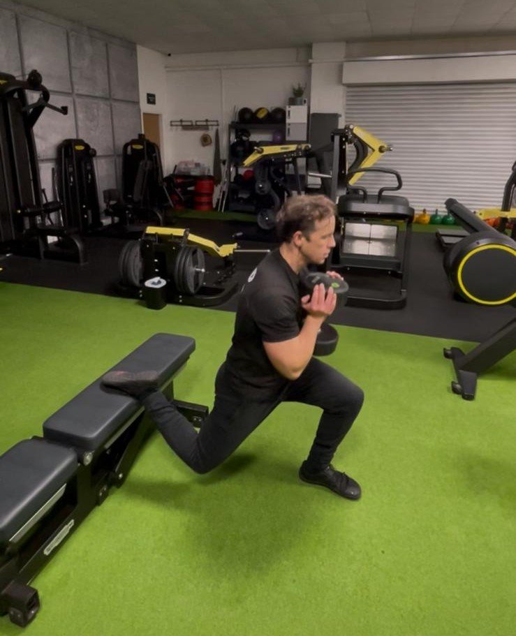 Bulgarian split squat demonstrating the unilateral movement pattern